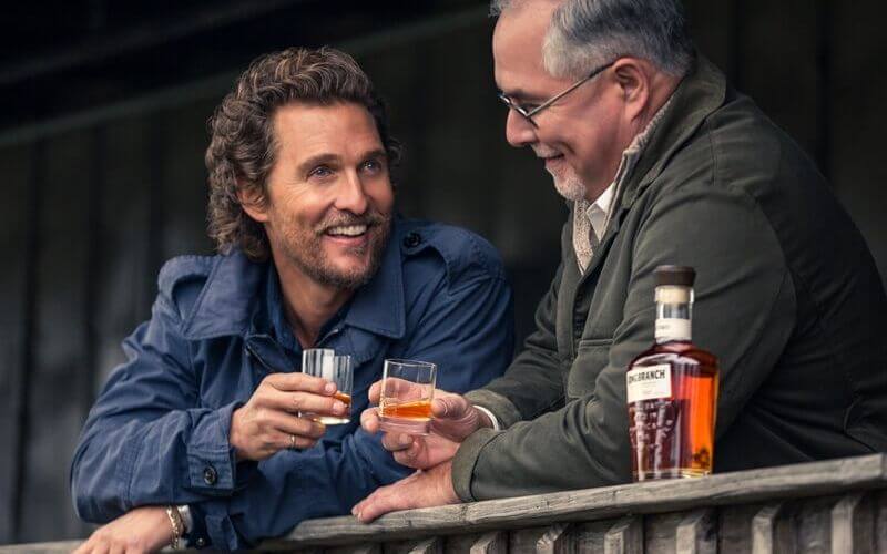 Matthew McConaughey and Eddie Russell with glasses of their whiskey - Image by The Whisky Exchange