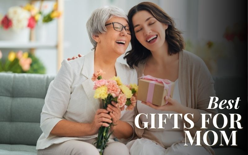 Mother and Daughter holding flowers and a gift