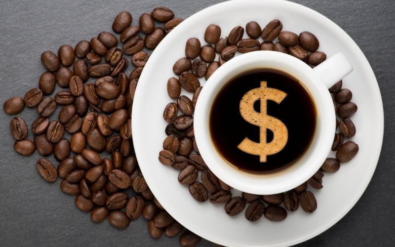 Coffee beans and dollar-sign on coffee