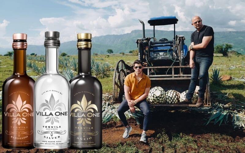 Nick Jonas and John Varvatos in a plantation with three Villa One tequilas