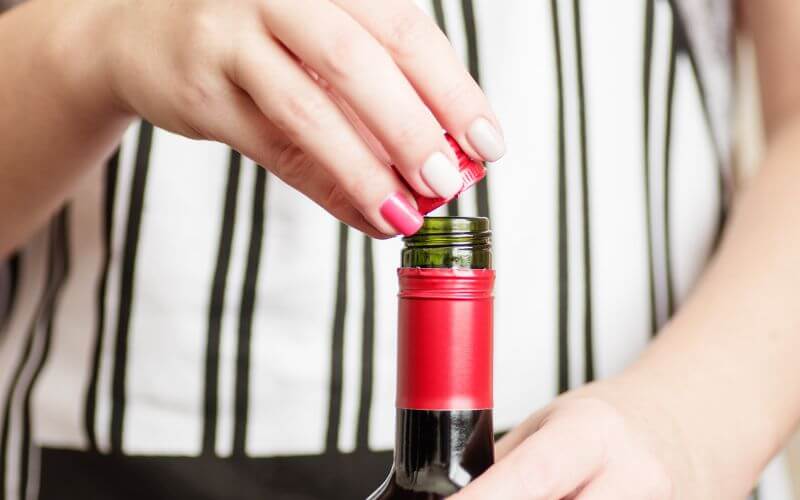 Opening a wine bottle with a screw cap