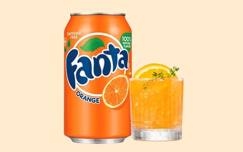 Orange soda beside an orange cocktail