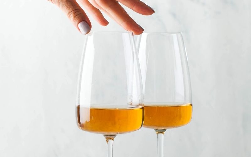 Orange wine in wine glasses