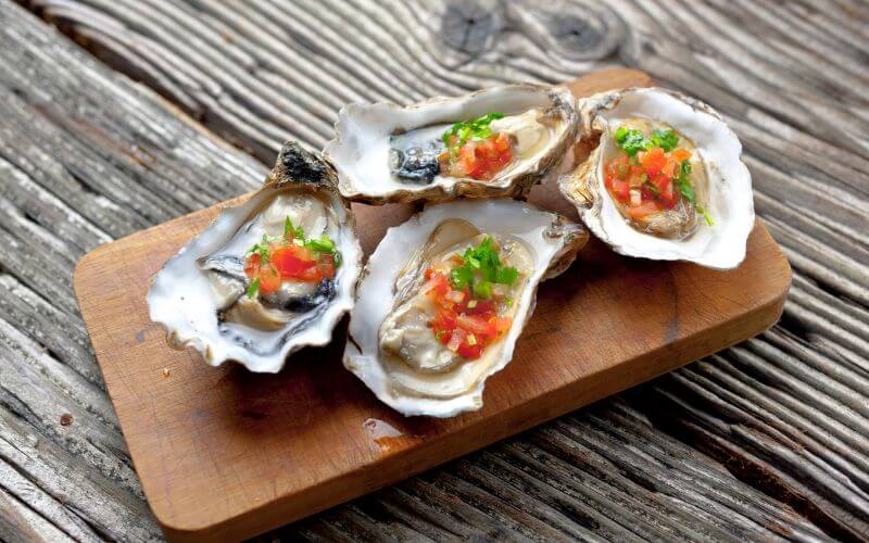 Oysters served on a wooden tray