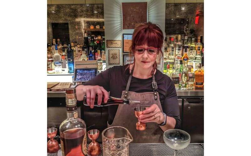 Paula Lukas making a cocktail drink