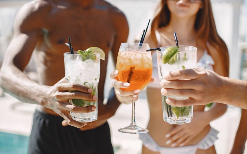 People drinking cocktails on a boat