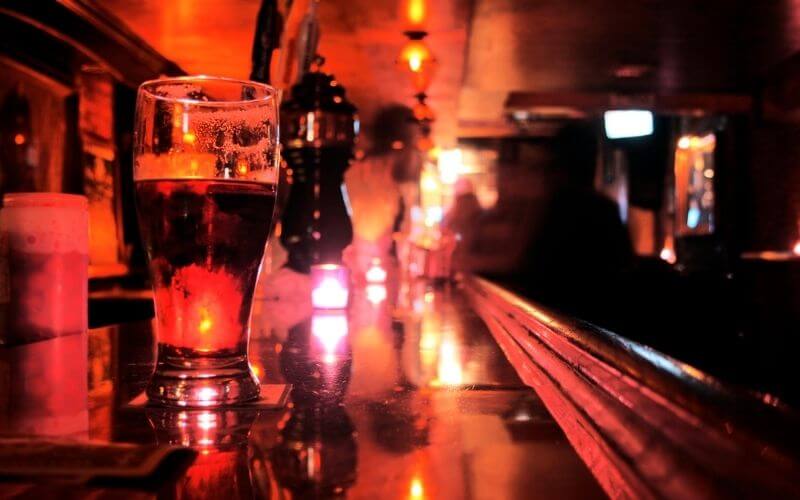 Pint Glass on Bar Top - New York City Dive Bar