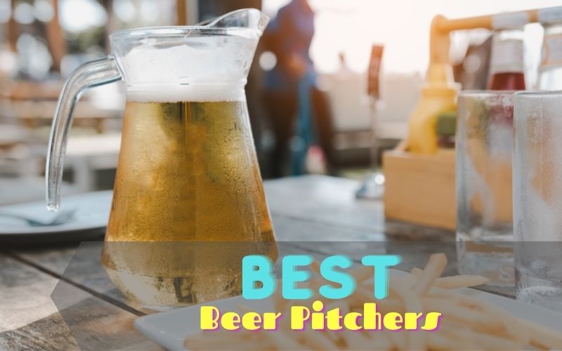 Pitcher of beer and empty beer mugs on a wooden table 