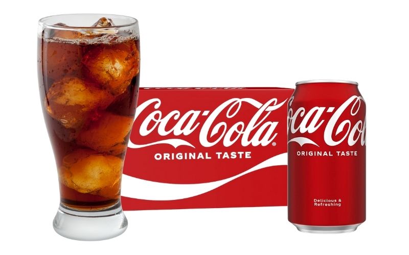 Pouring coca-cola into glasses with ice