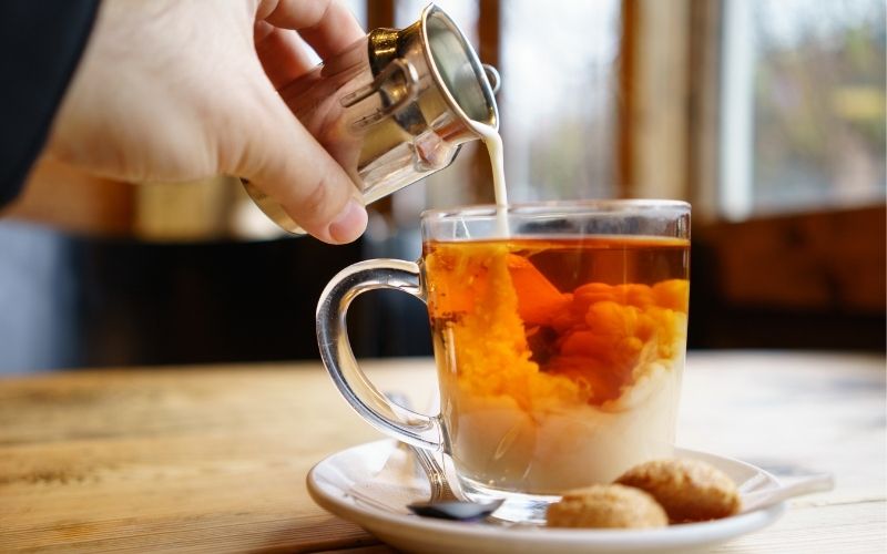 Pouring cream into English Tea