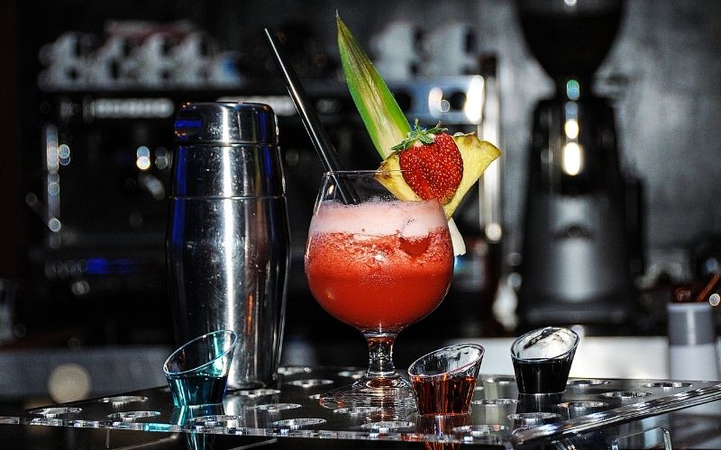 Red cocktail Garnished with dried strawberry