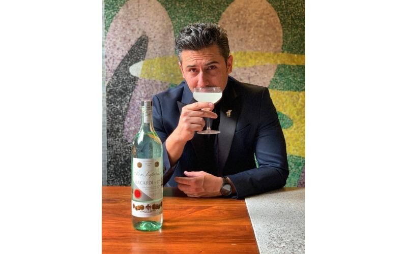 Ricardo Nava holding a glass of cocktail