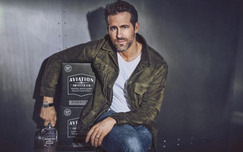 Ryan Reynolds with a bottle of Aviation Gin 