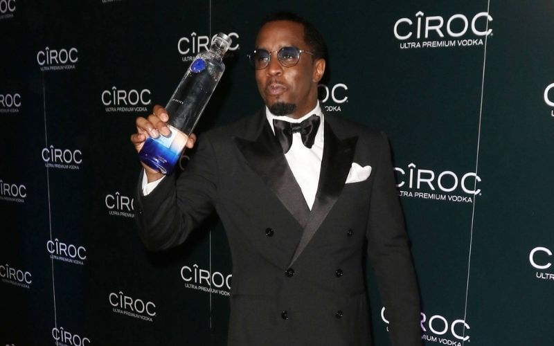 Sean "Diddy" Combs holding a Ciroc bottle during an event - Image by Haute Living