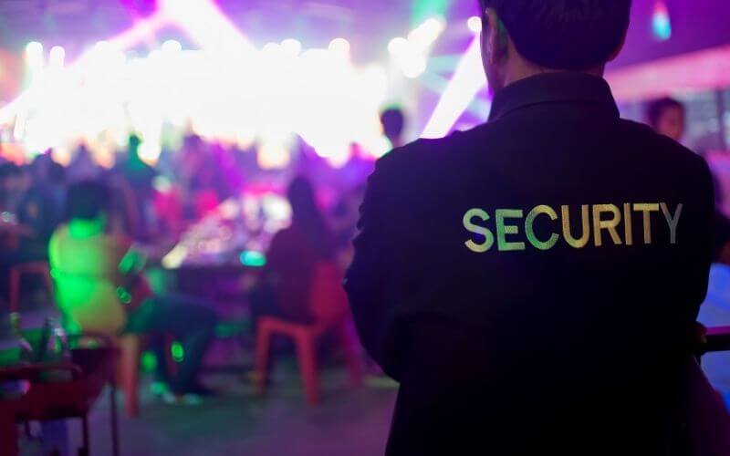 Security guard  observing people at a cocktail hour