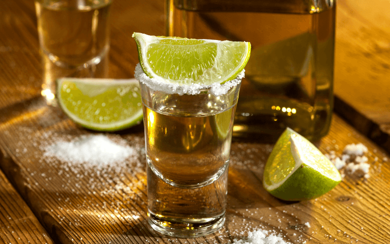 Shot of tequila with lime and salt