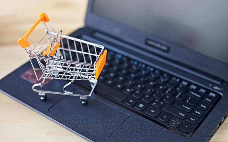 Small shopping cart on a laptop