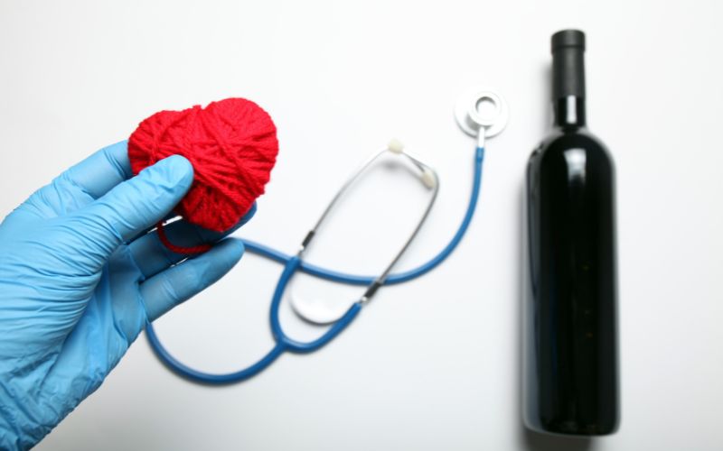 Sphygmomanometer with a bottle of wine
