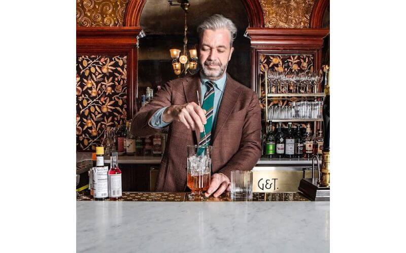 St. John Frizell making a cocktail