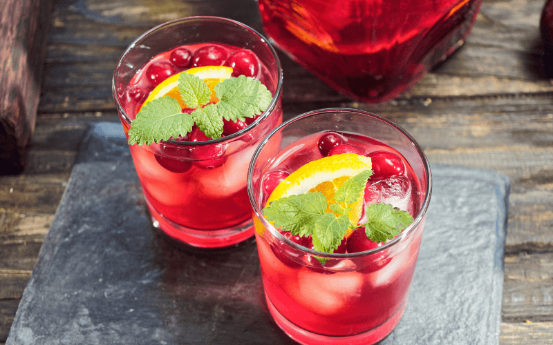 Two glasses of Virgin Cranberry Basil Sangria