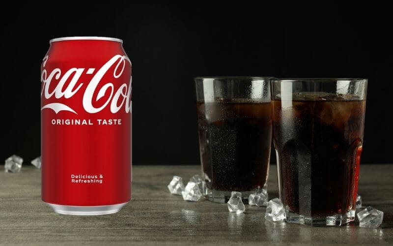 Two glasses of coke with ice cubes