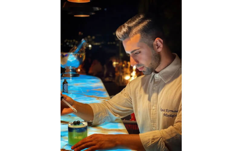Umit Krimizialan making a cocktail