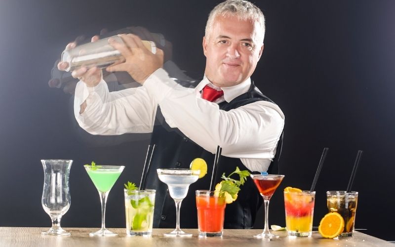 Professional bartender making cocktails