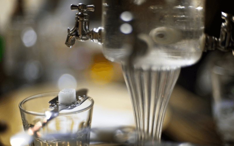 An absinthe glass with an absinthe fountain