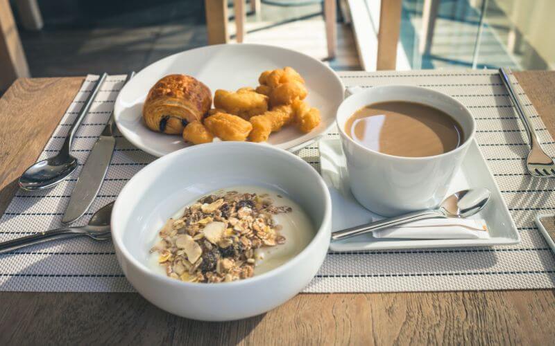 An oatmeal with some other snacks on a table