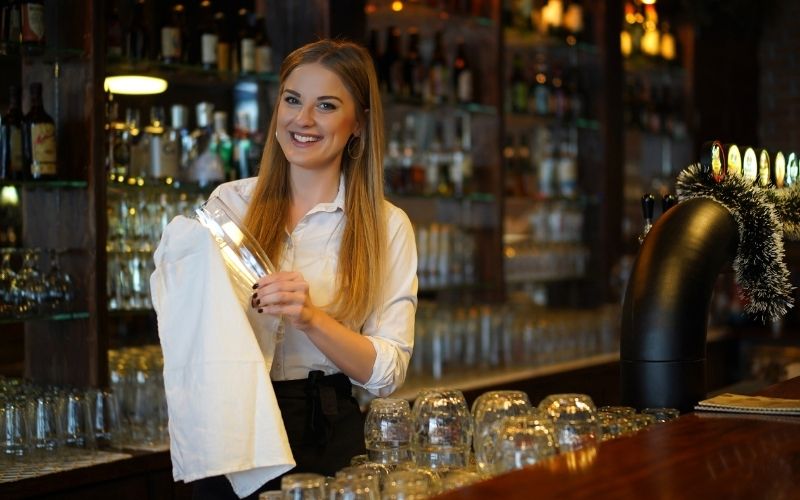 Woman working as a barback