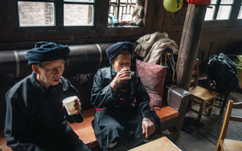 Asian old couple drinking snake wine