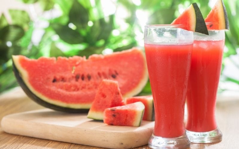 Watermelon juice in tall glasses with slices