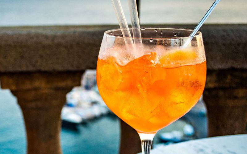 A glass of White Claw Aperol Spritz