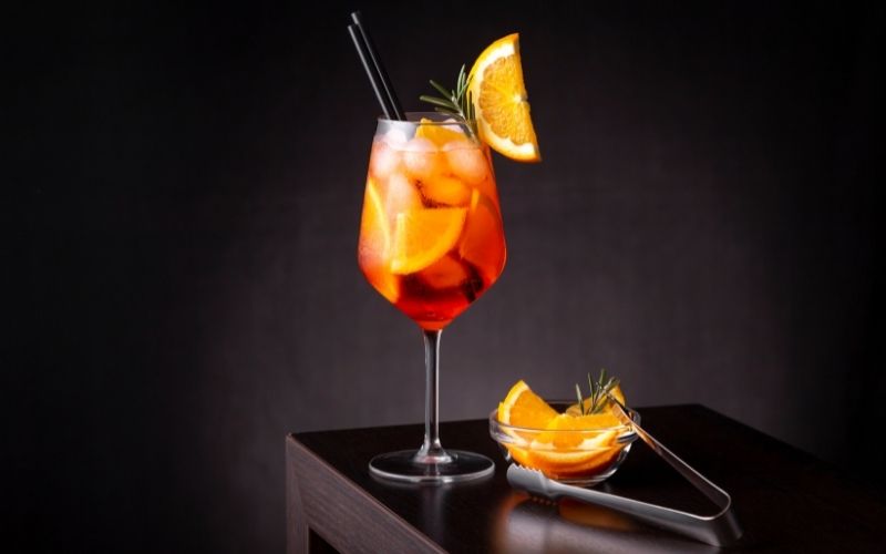 A glass of Aperol Spritz cocktail in a wine glass