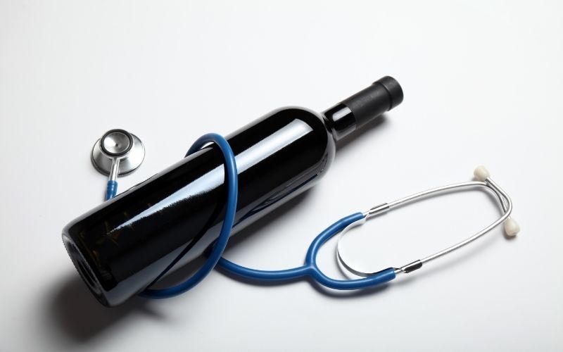 Wine bottle wrapped in stethoscope