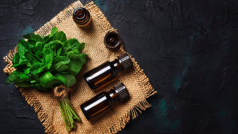 A bundle of peppermint with bottles