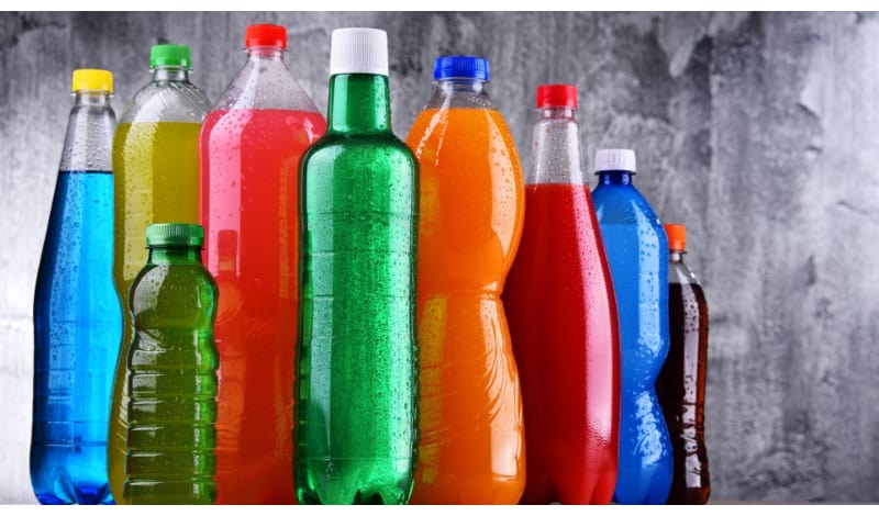 An assortment of colorful plastic soda bottles