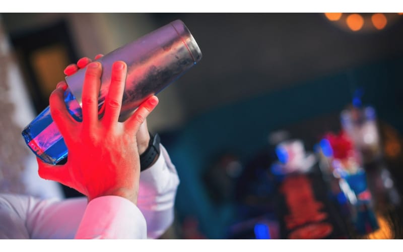 Bartender using a cocktail shaker