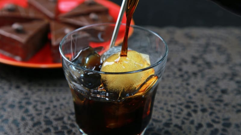 Black Kahlua served in a glass with ice cubes