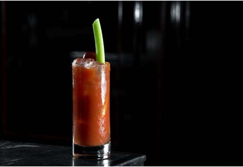 Bloody Mary on a bar desk in black background