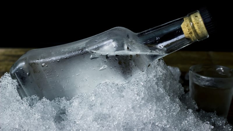 Bottle of vodka coated in ice shavings