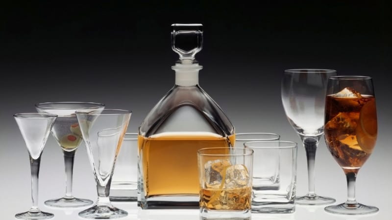 Bourbon in a decanter with various glasses
