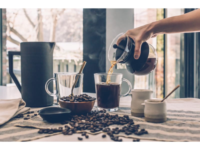 Brewed coffee being poured to a cup