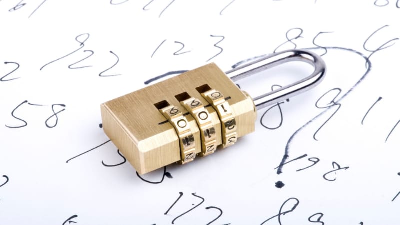 Combination lock with numbers written on a paper