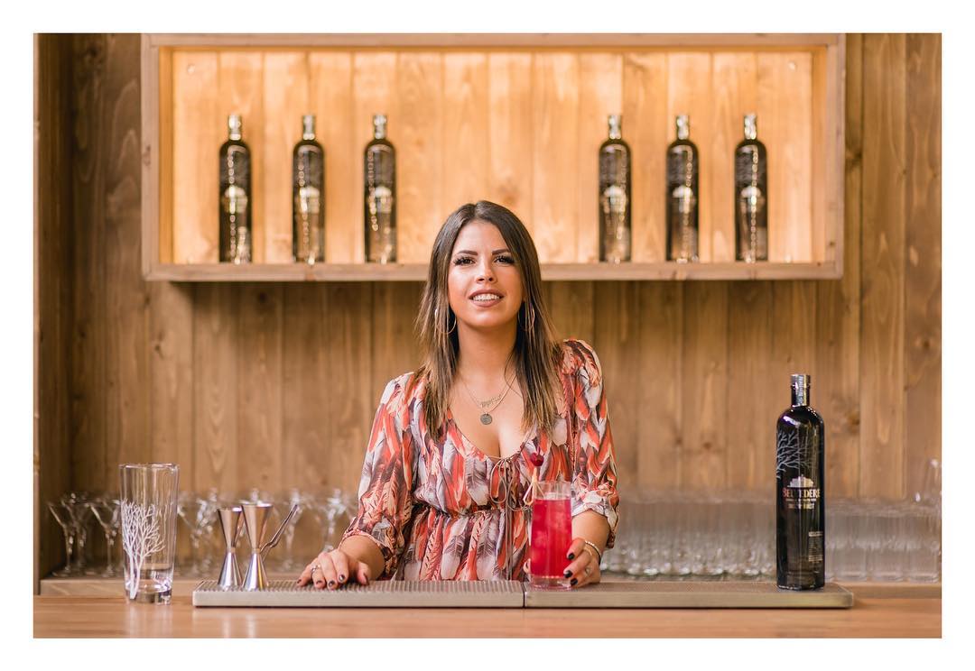 Dimitra Adonakopoulou holding a glass of cocktail