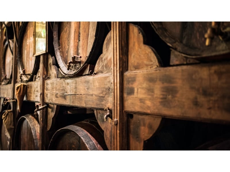 Aging whiskey in wooden barrels 