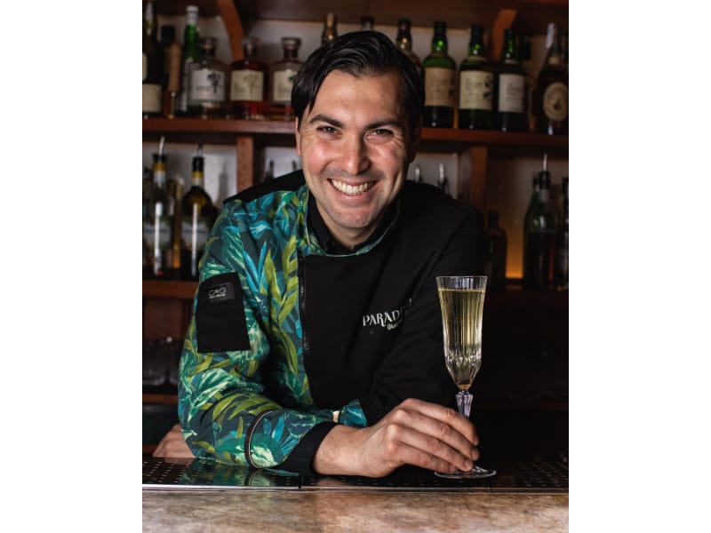 Giacomo Giannotti holding a glass of wine