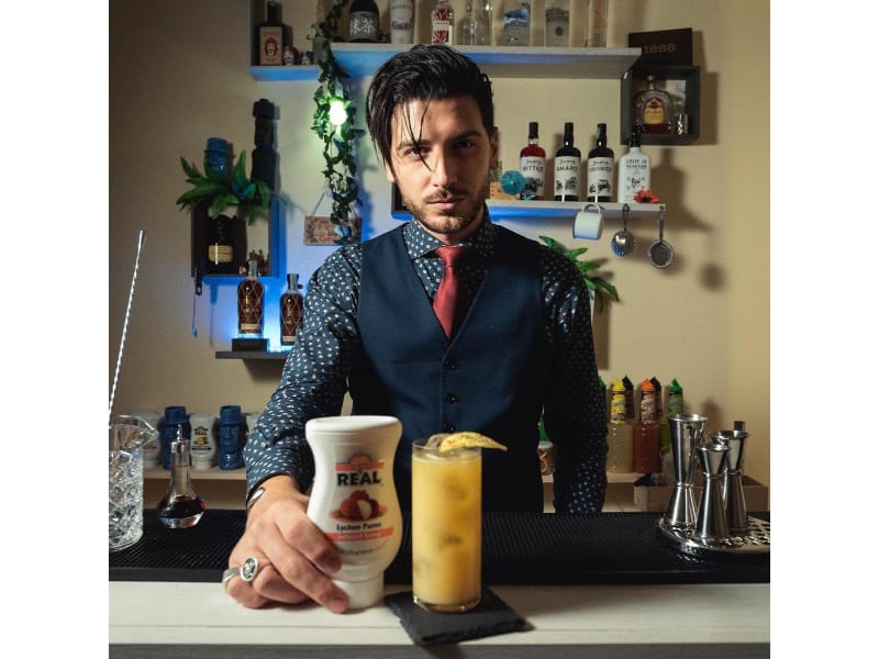 Giorgio Chiarello with a glass of cocktail 