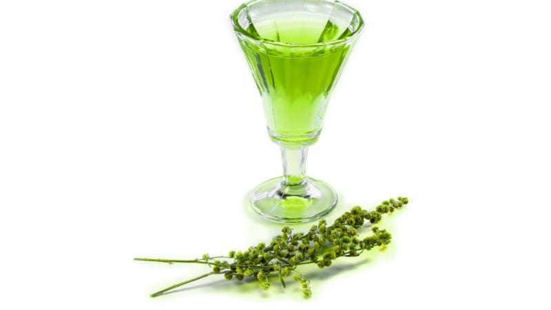 Glass of absinthe with flowers