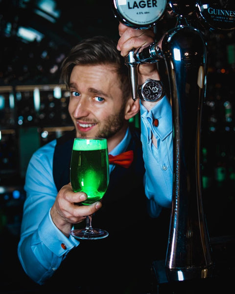 Ivan Skyba holding a glass of cocktail